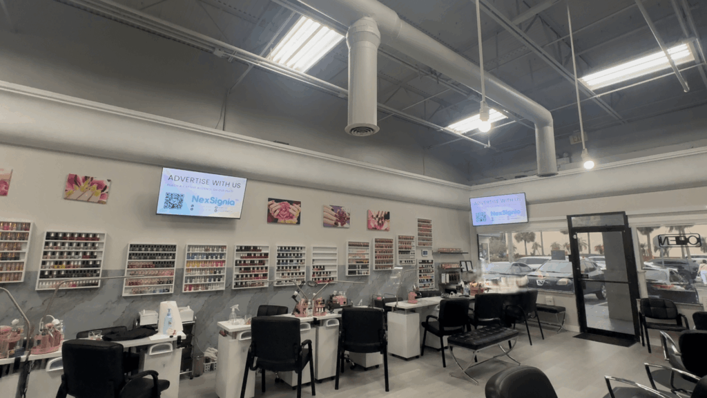Local business advertising screen inside a premium beauty salon