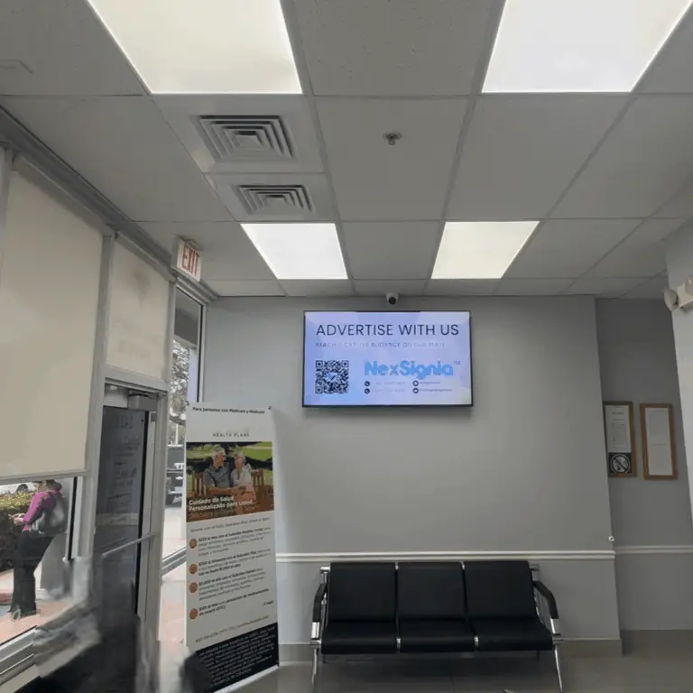 NexSignia digital signage screen in a medical clinic waiting room
